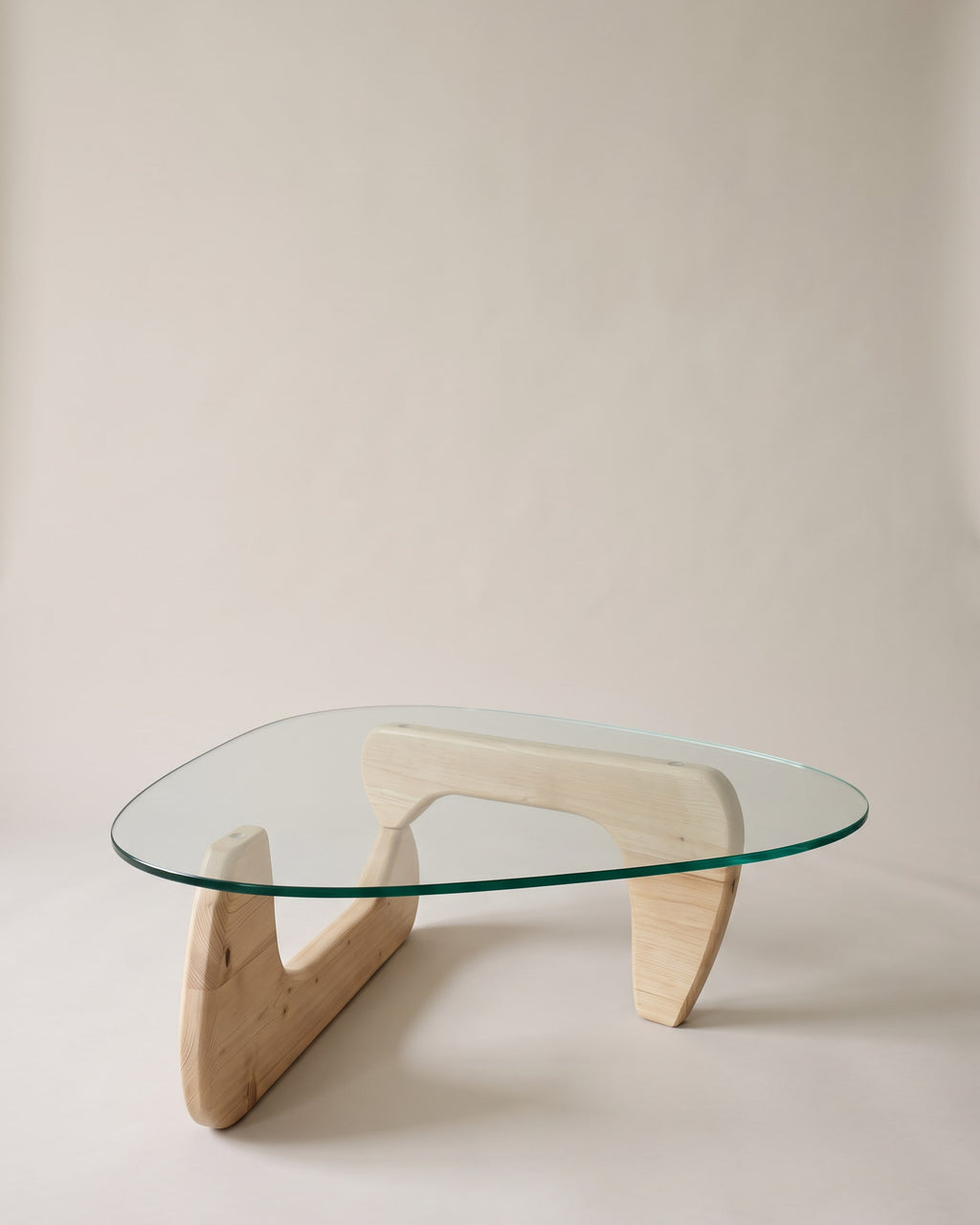 Elara coffee table in light oak on a plain greige studio background